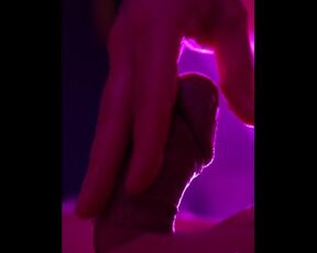 Solo groaning mastrubation with massive cumshot close-up in pink light